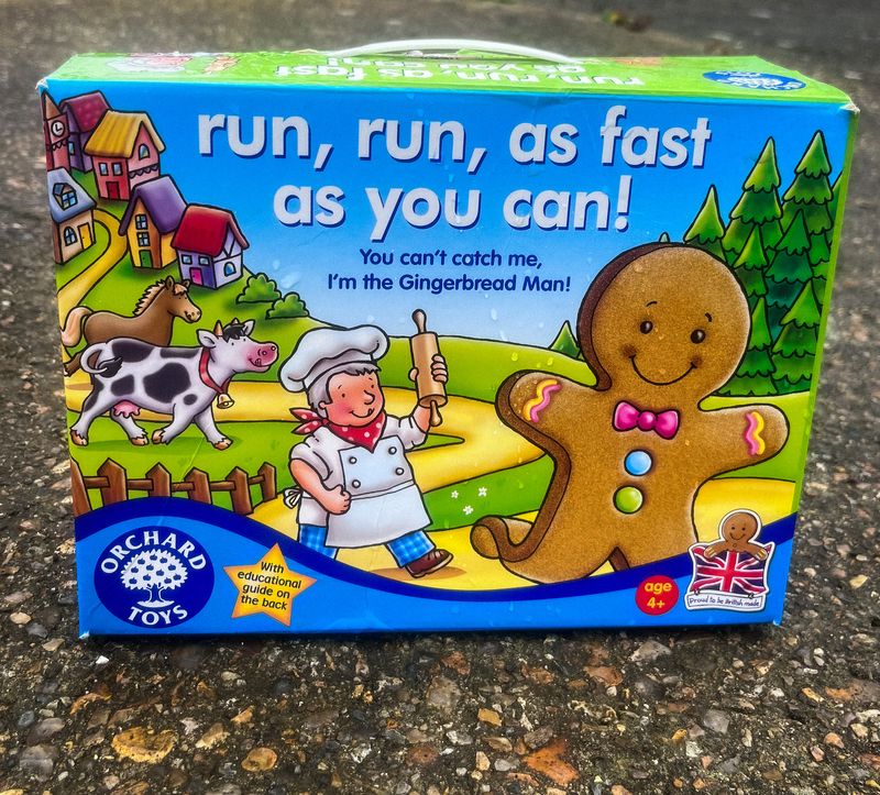 A board game called, ‘run, run, as fast as you can!’ left in front of a house at the top of a hill