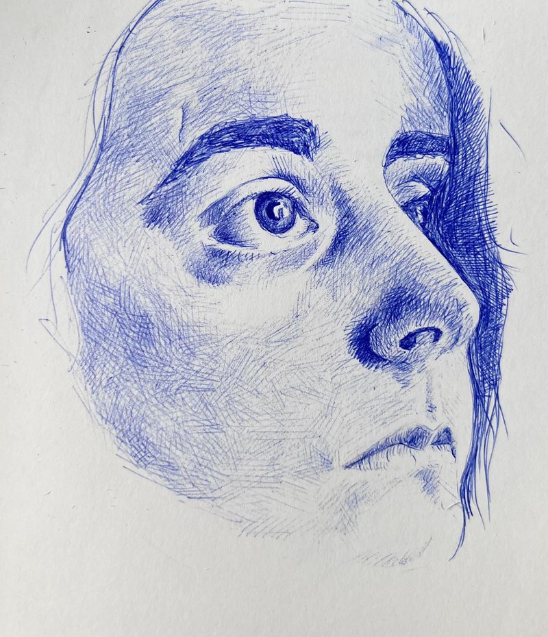 Blue bic crosshatch sketch of most of a woman’s face