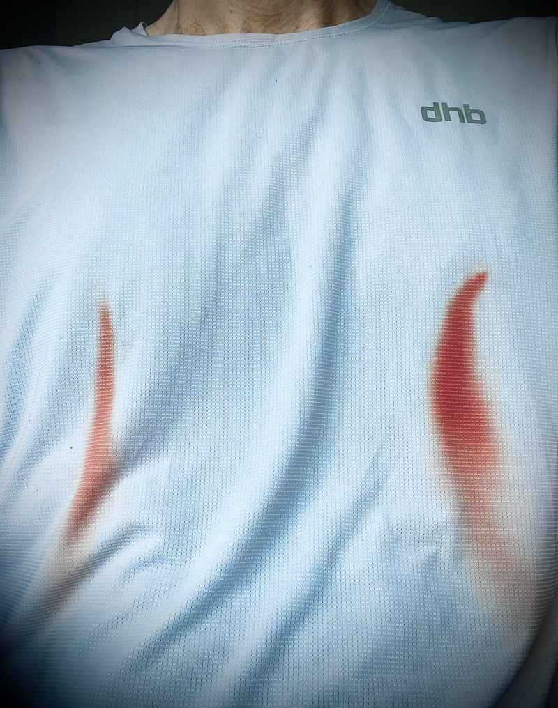 blood trails from nipples on a white running shirt